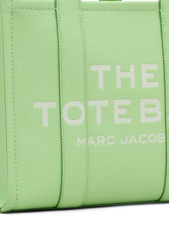 Close up of green bags,showing texture of the leather fabric.