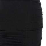 Close up of black skirt, showing texture of the cotton fabric