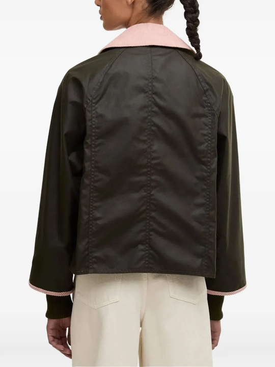 Black jackets-coats worn by a person, showing the jackets-coats's fit