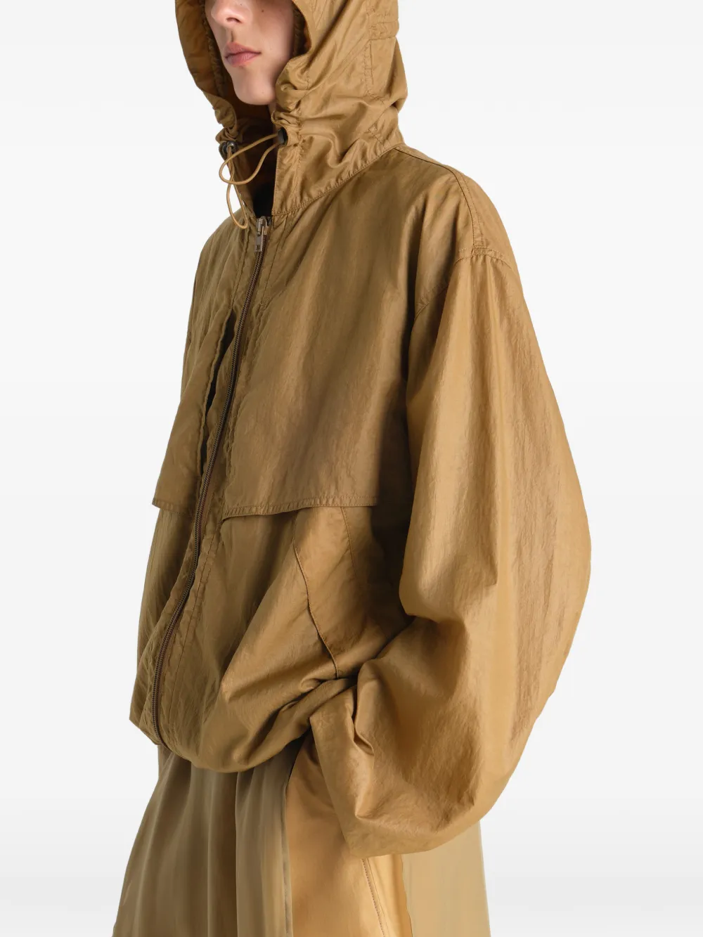 Tan jacket worn by a person, showing the jacket fit