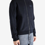 Navy coat worn by a person, showing the coat's fit