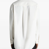 white shirts worn by a person, showing the shirts fit
