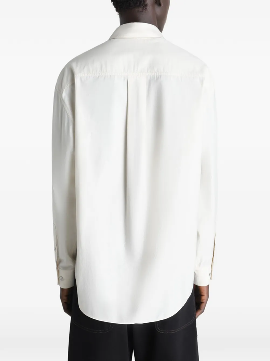 white shirts worn by a person, showing the shirts fit
