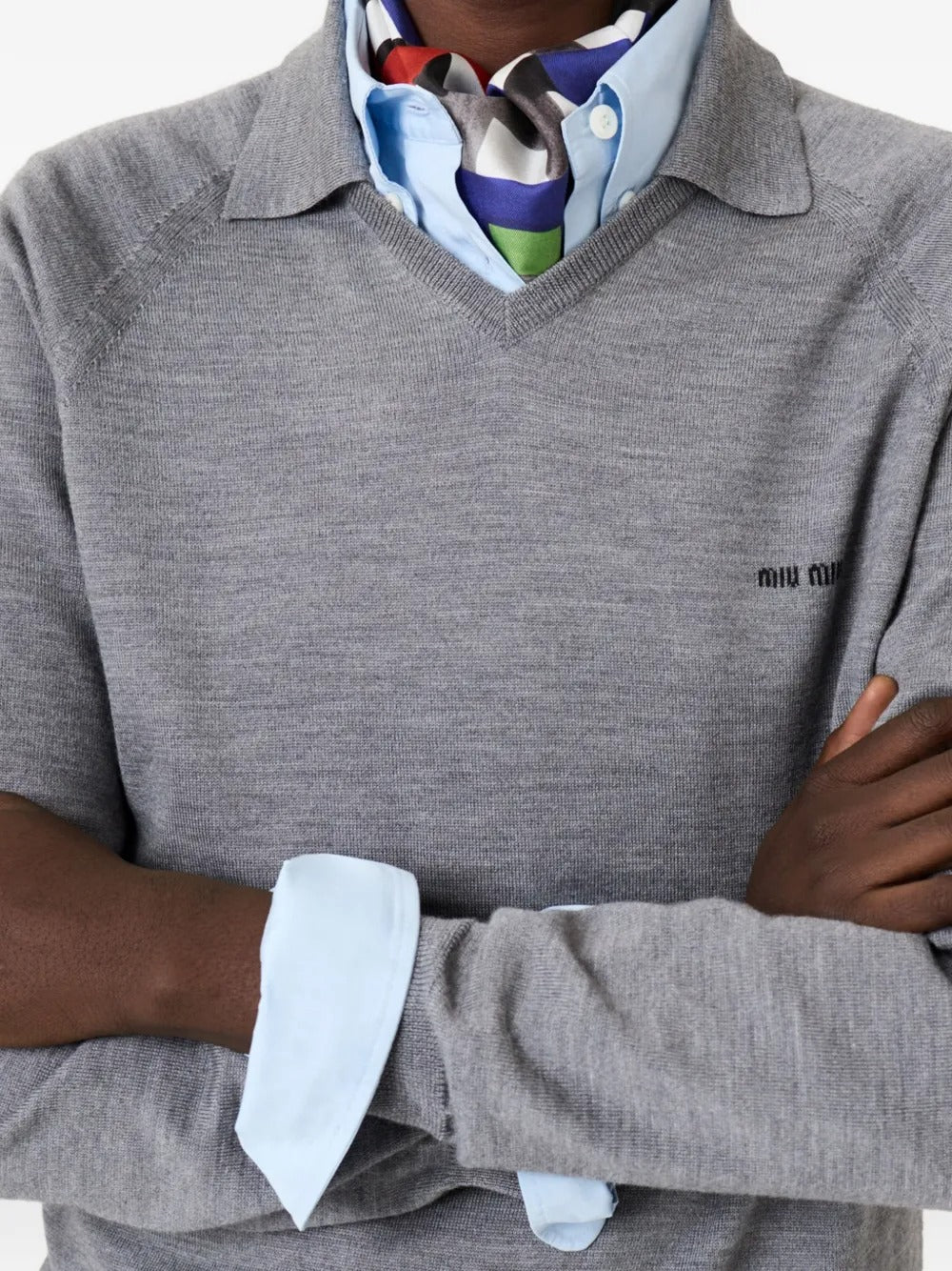 Close up of grey knitwear, showing texture of the wool fabric