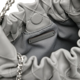 Close up of grey bag, showing texture of the leather fabric