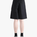 Black short worn by a person, showing the cotton fit