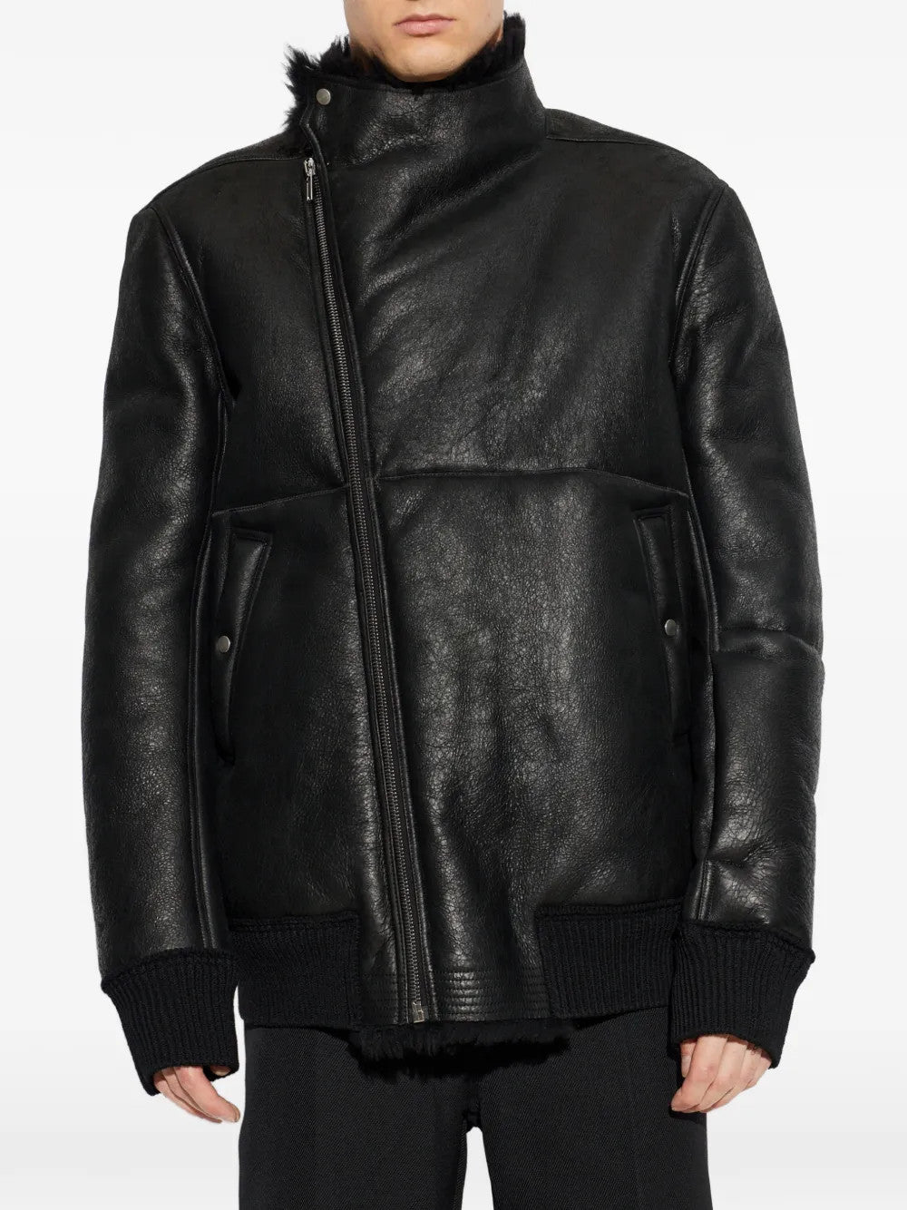 Black jacket worn by a person, showing the jacket fit