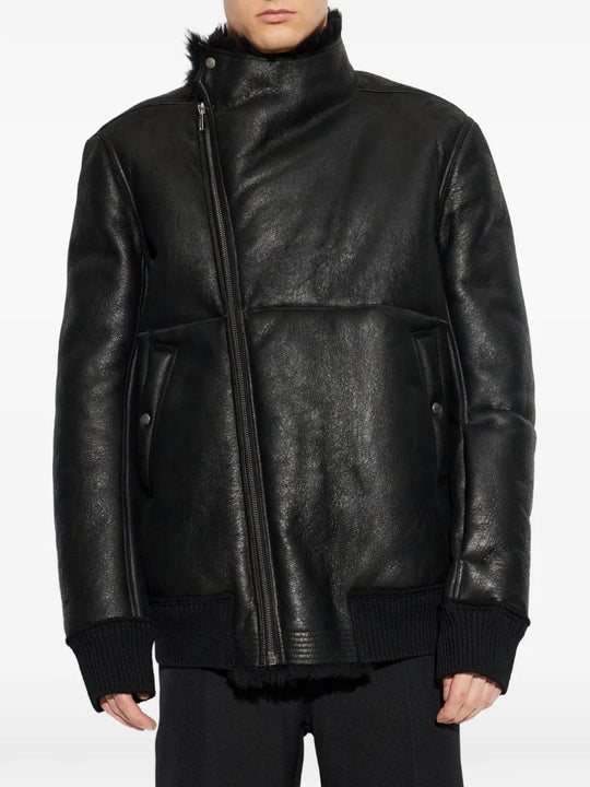 Black jacket worn by a person, showing the jacket fit