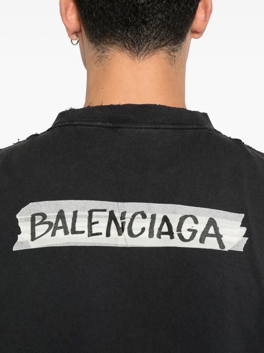 Close up of black t-shirt, showing texture of the Cotton fabric