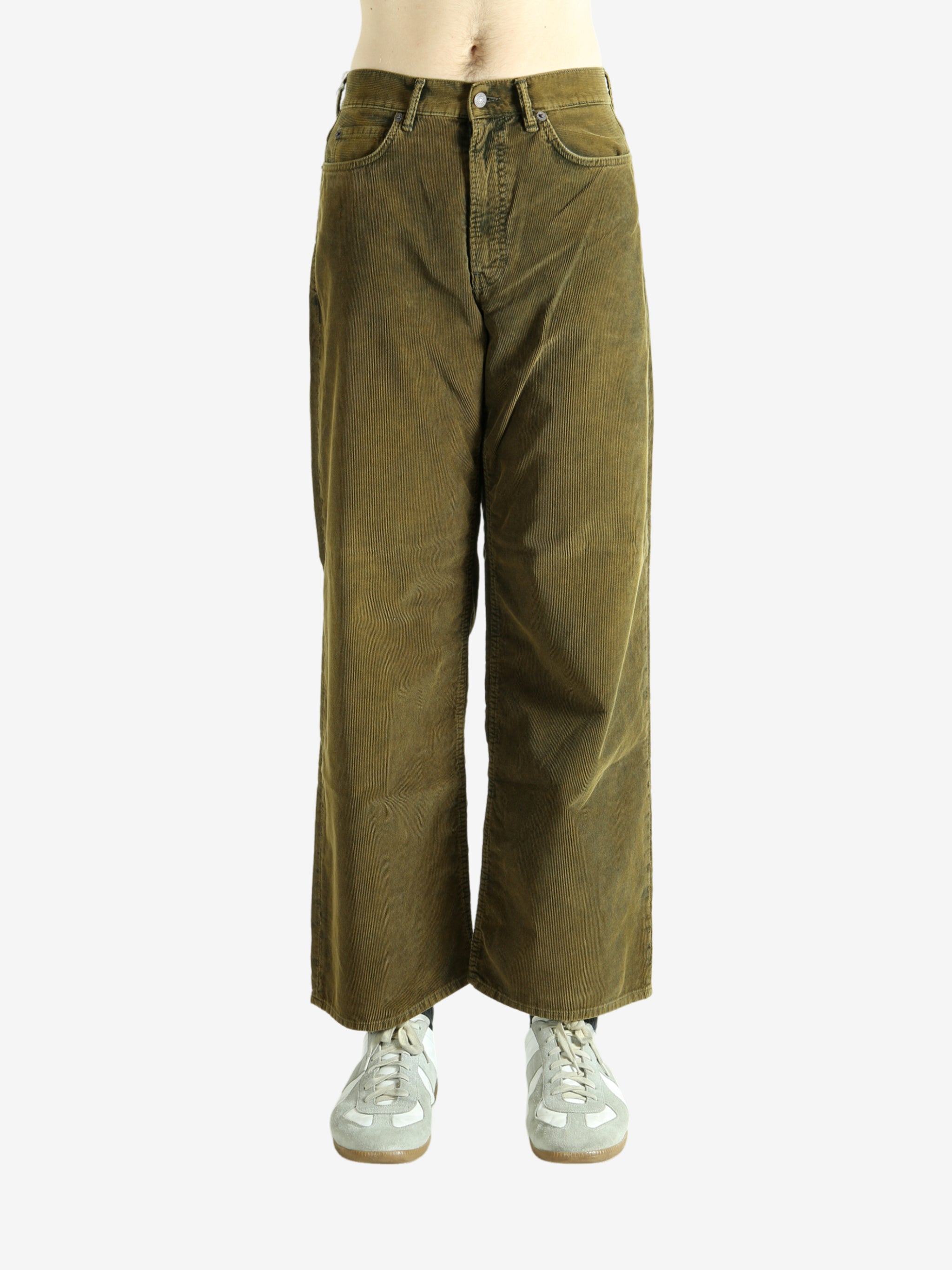 Green pant worn by a person, showing the pant's fit