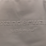 Close up of grey bag,showing texture of the cotton fabric.