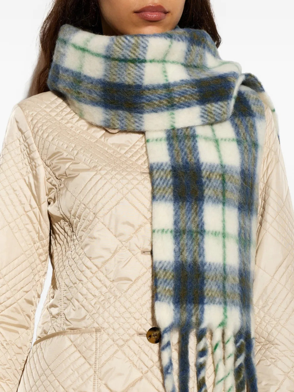 Blue scarf worn by a person, showing the scarf fit