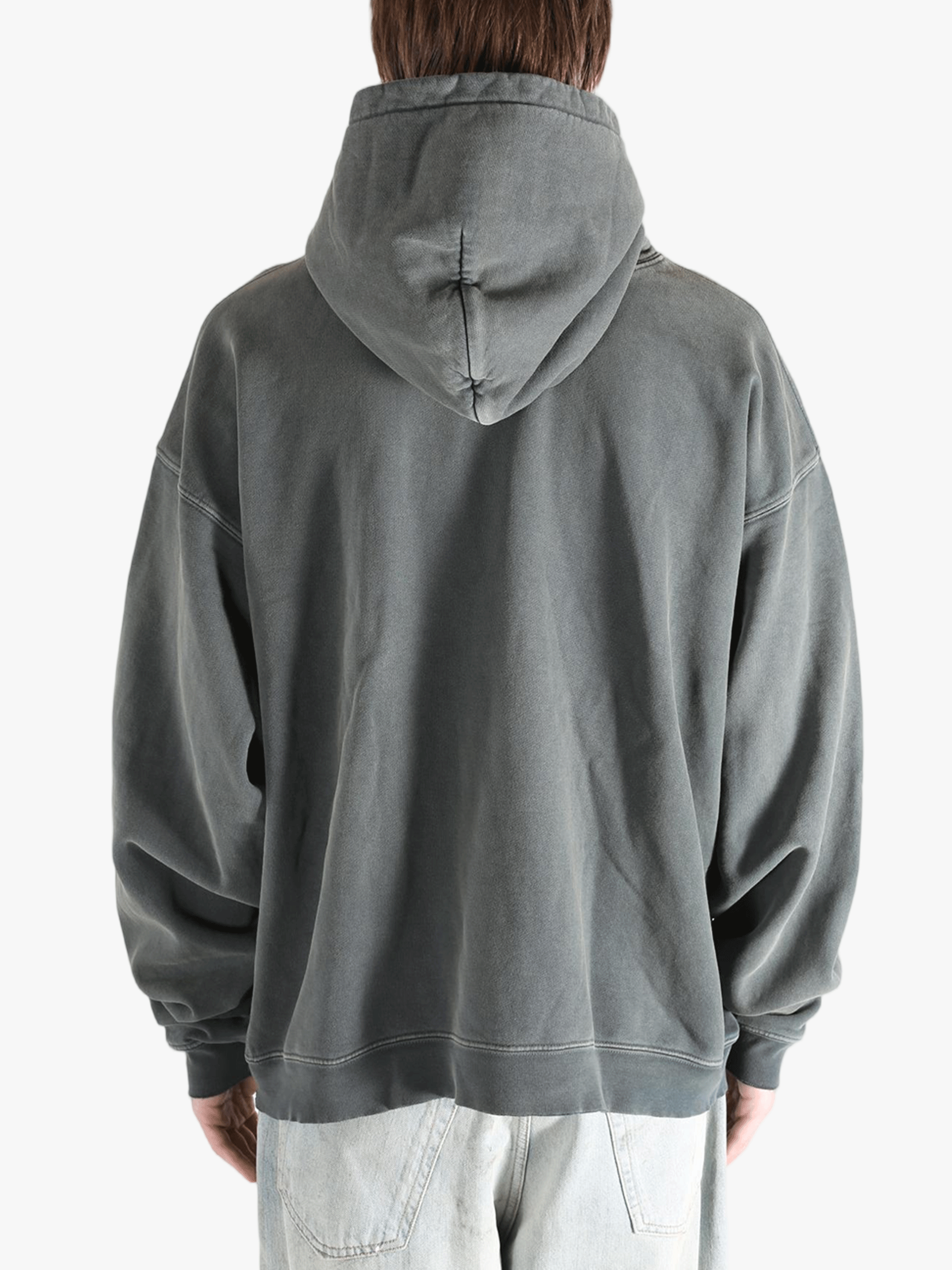 Grey hoodie worn by a person, showing the hoodie's fit