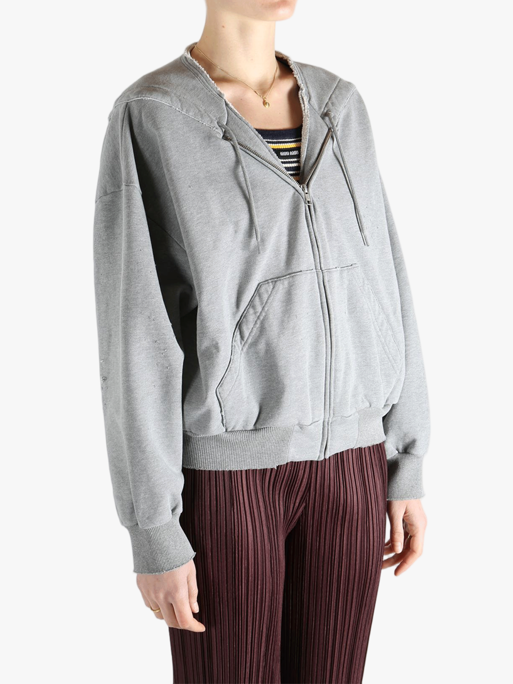 Grey jackets-coats worn by a person, showing the jackets-coats'fit