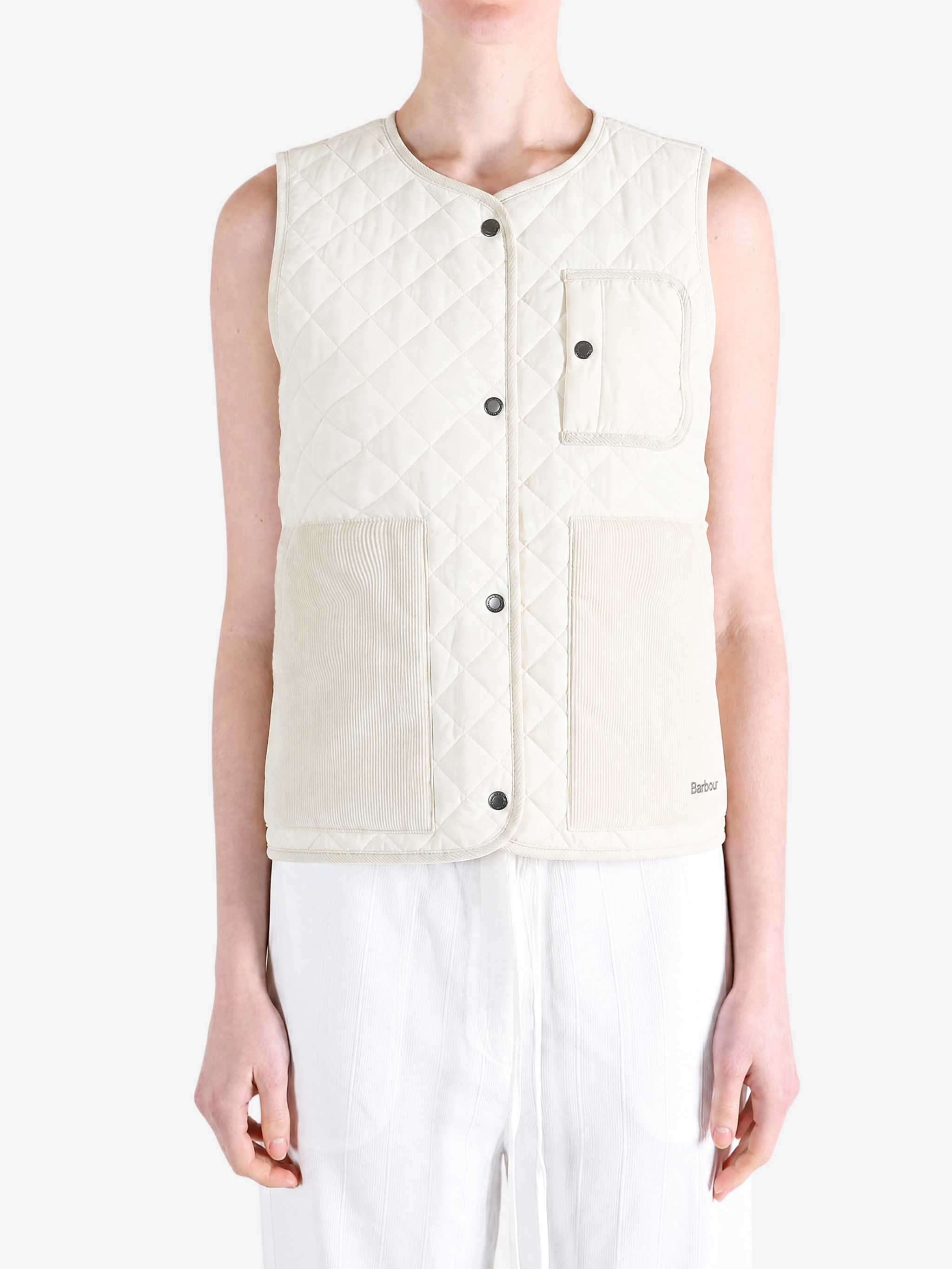 Tan top worn by a person, showing the top fit