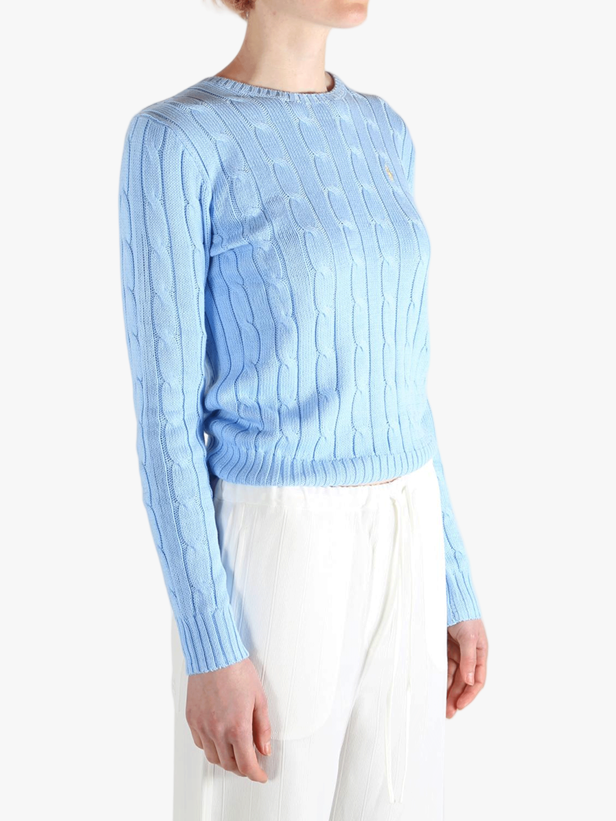blue knitwear worn by a person, showing the knitwear  fit