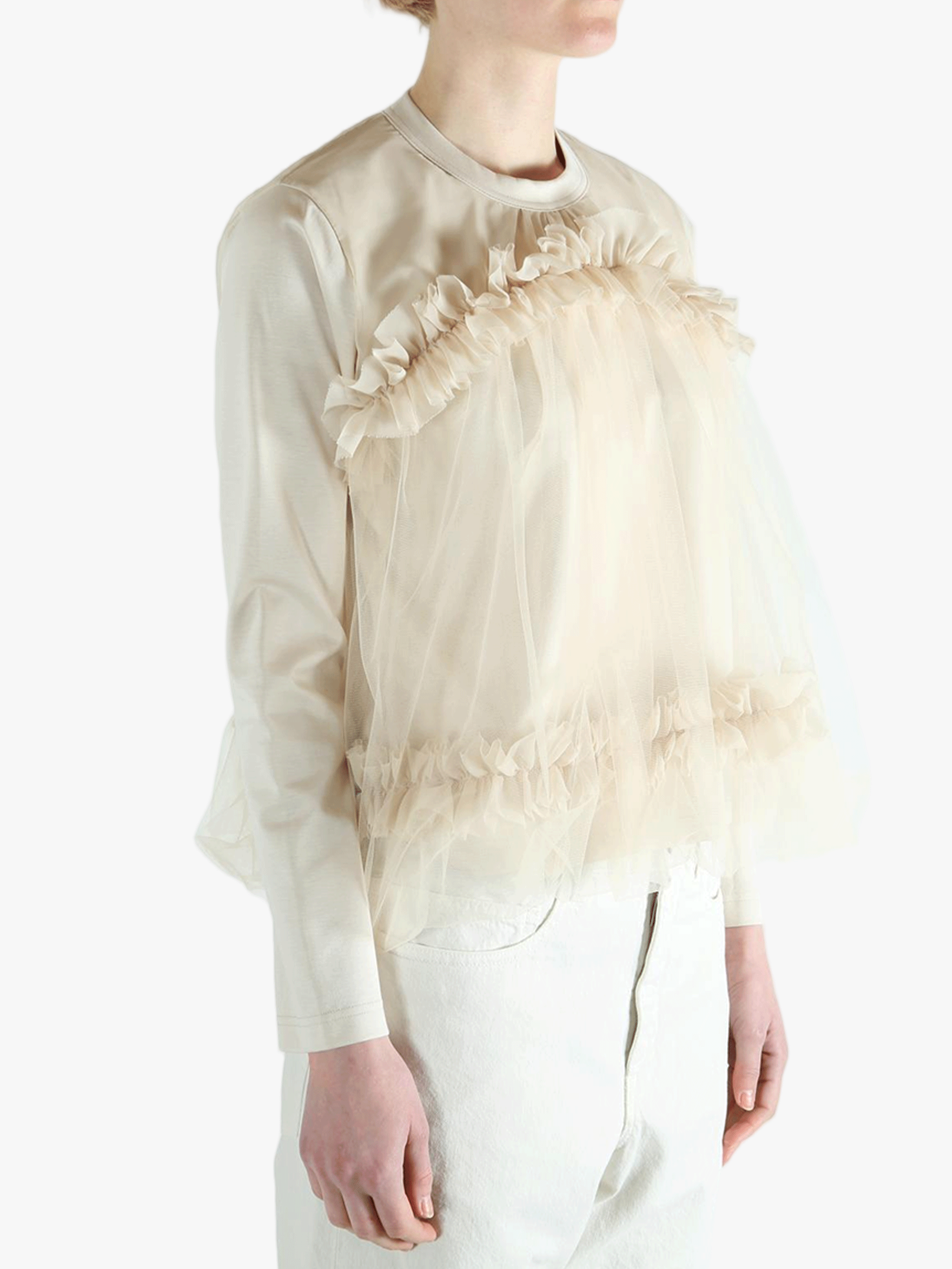 Tan t-shirts worn by a person, showing the t-shirts fit