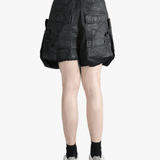 Black shorts worn by a person, showing the shorts fit