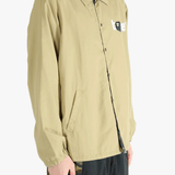 Tan jacket worn by a person, showing the jacket's fit