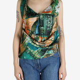 Green top worn by a person, showing the top’s fit