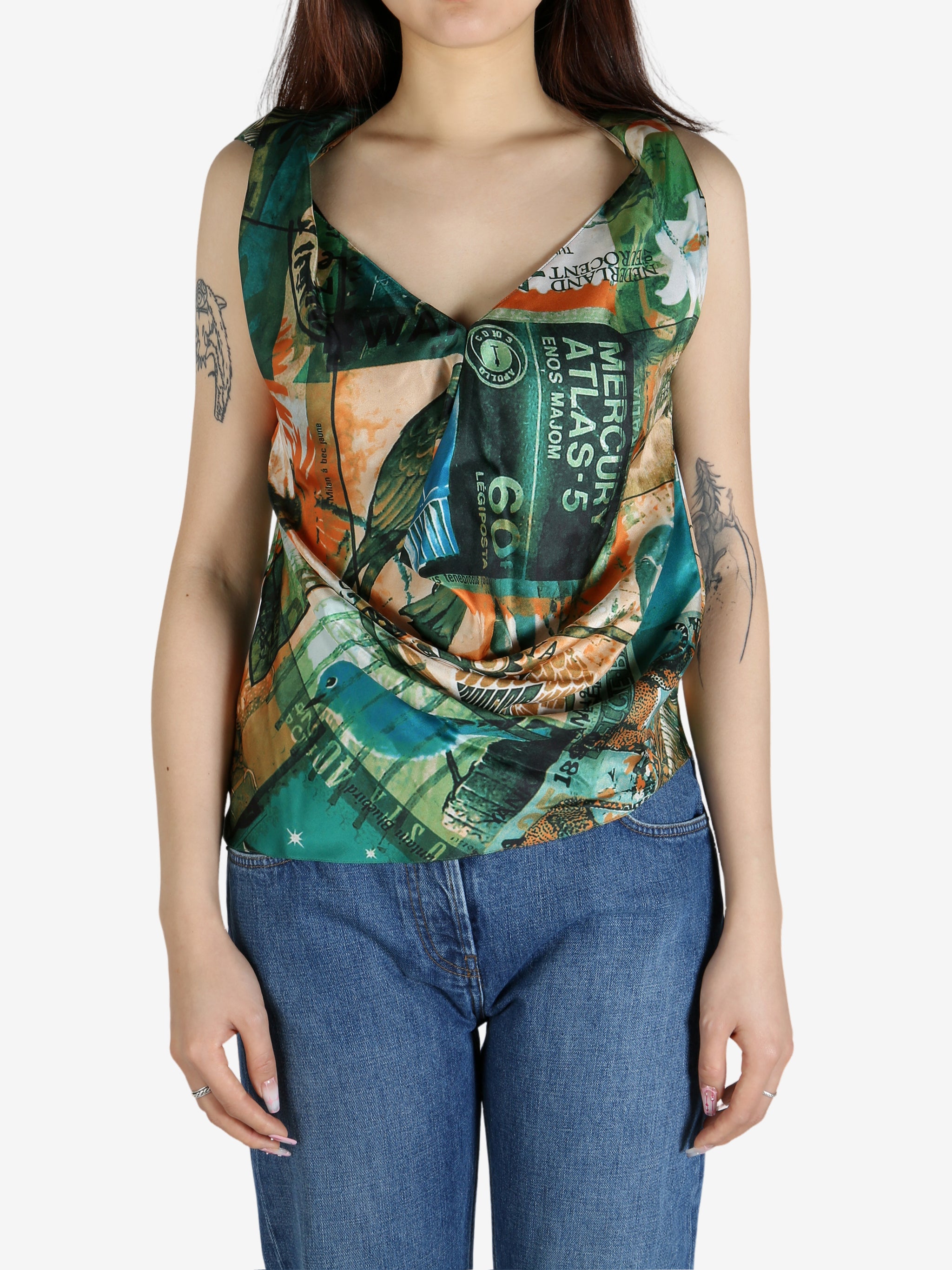 Green top worn by a person, showing the top’s fit