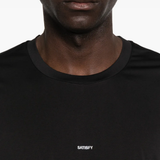 Black t-shirt worn by a person, showing the t-shirt fit