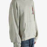 Grey hoodie worn by a person, showing the hoodie's fit