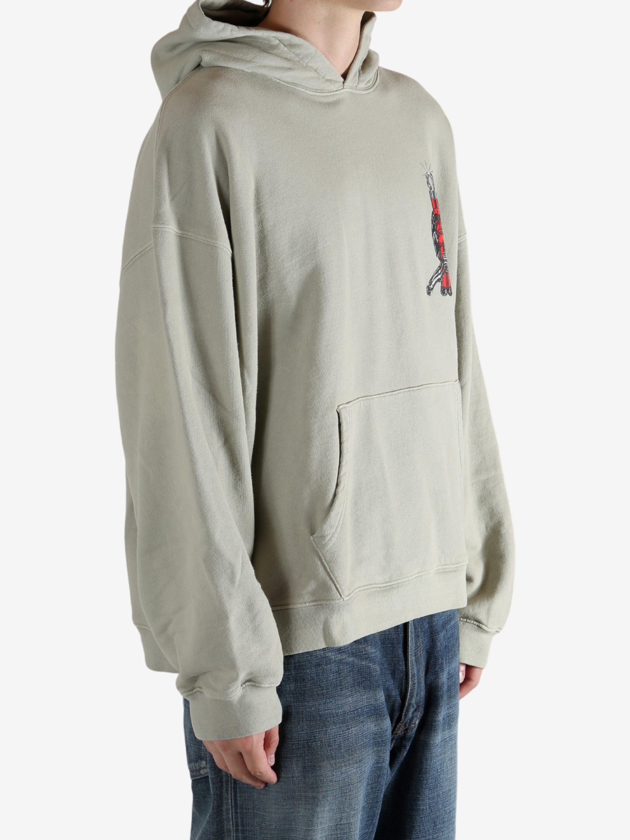 Grey hoodie worn by a person, showing the hoodie's fit