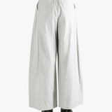 Grey pants worn by a person, showing the pants' fit