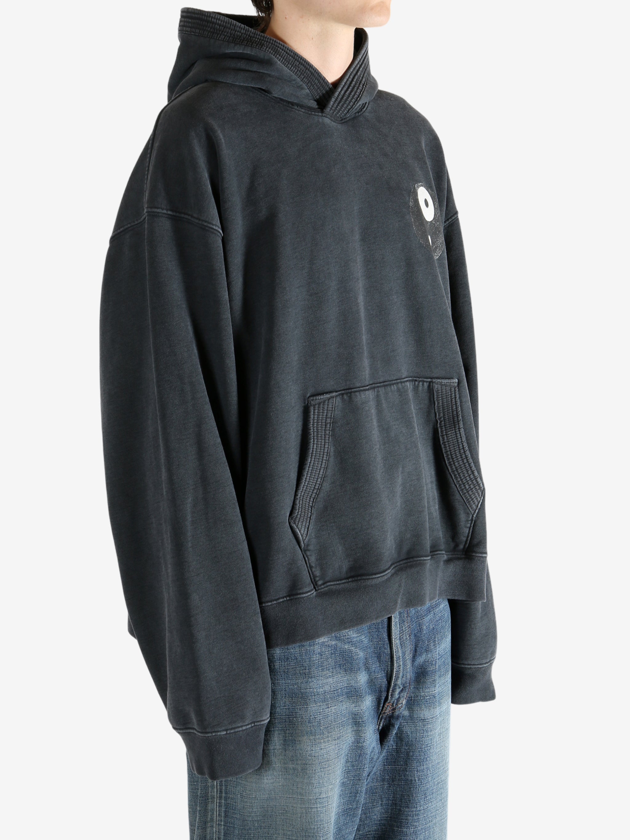 Black hoodie worn by a person, showing the hoodie's fit