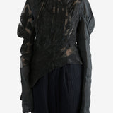 Black top worn by a person, showing the top's fit