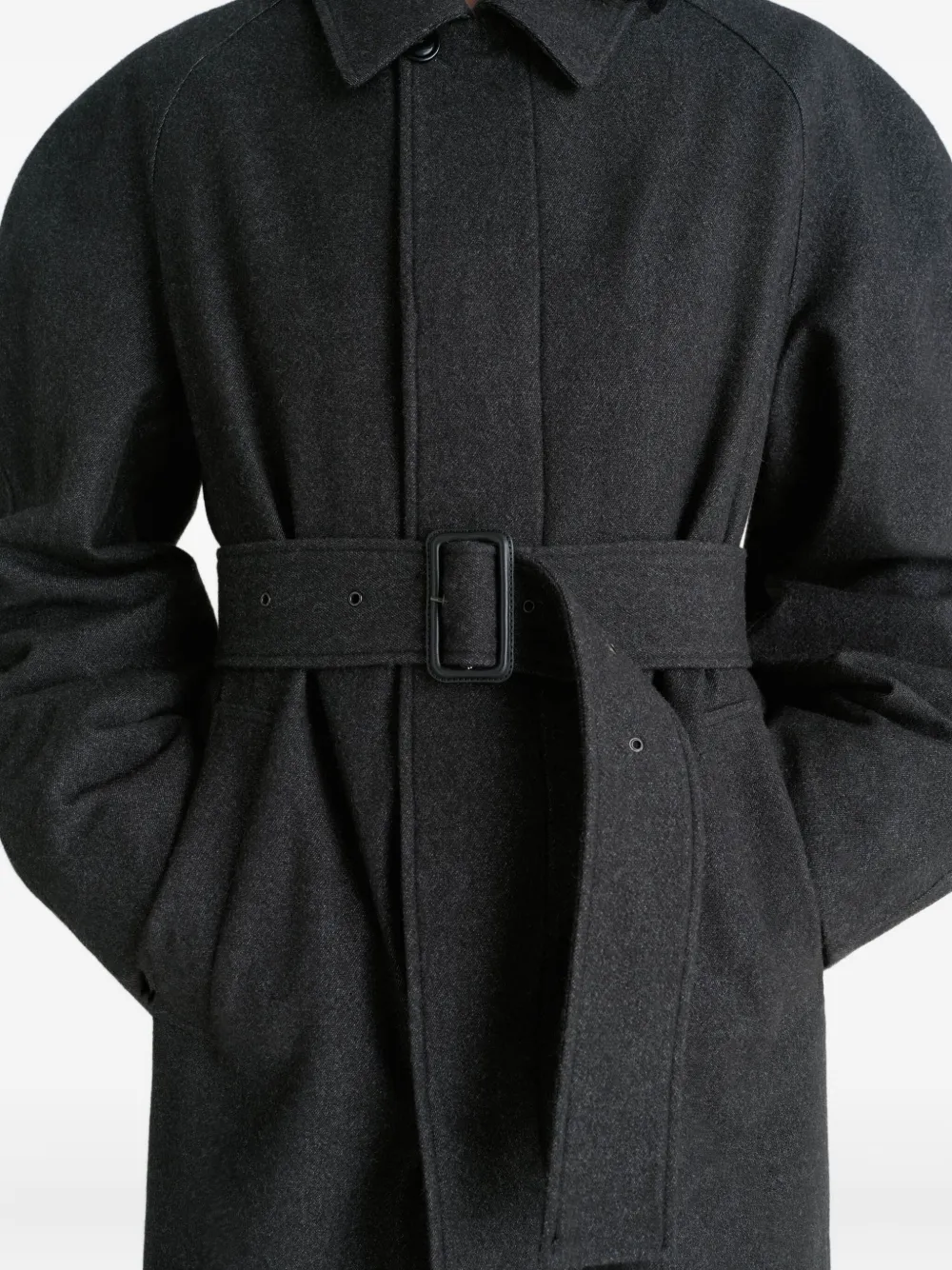 Close up of black coats, showing texture of the Virgin Wool and cotton fabric