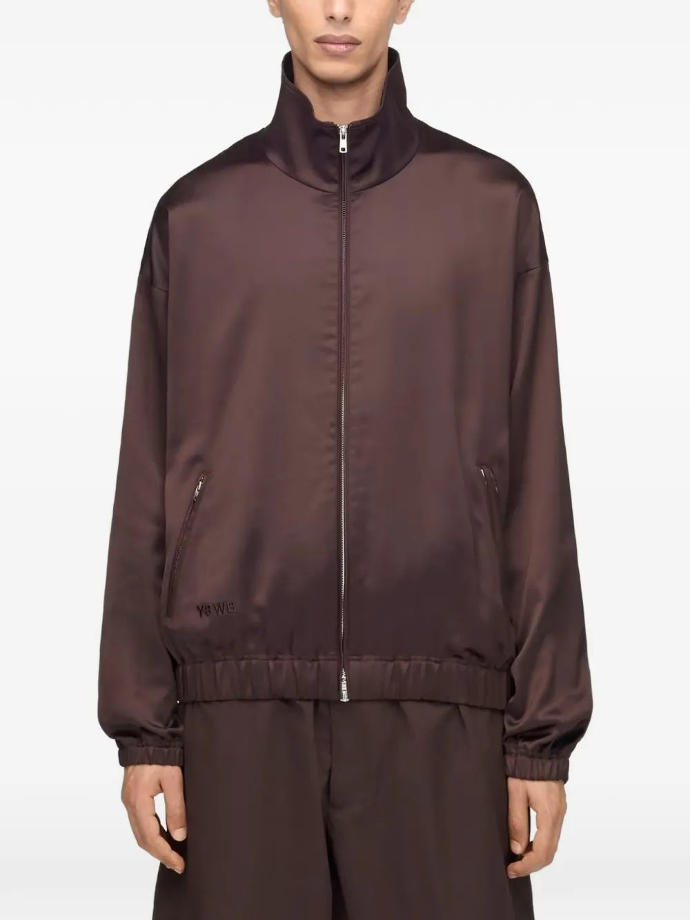 Brown jacket worn by a person, showing the jacket's fit