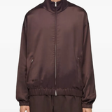 Brown jacket worn by a person, showing the jacket's fit