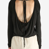 Brown top worn by a person, showing the top fit