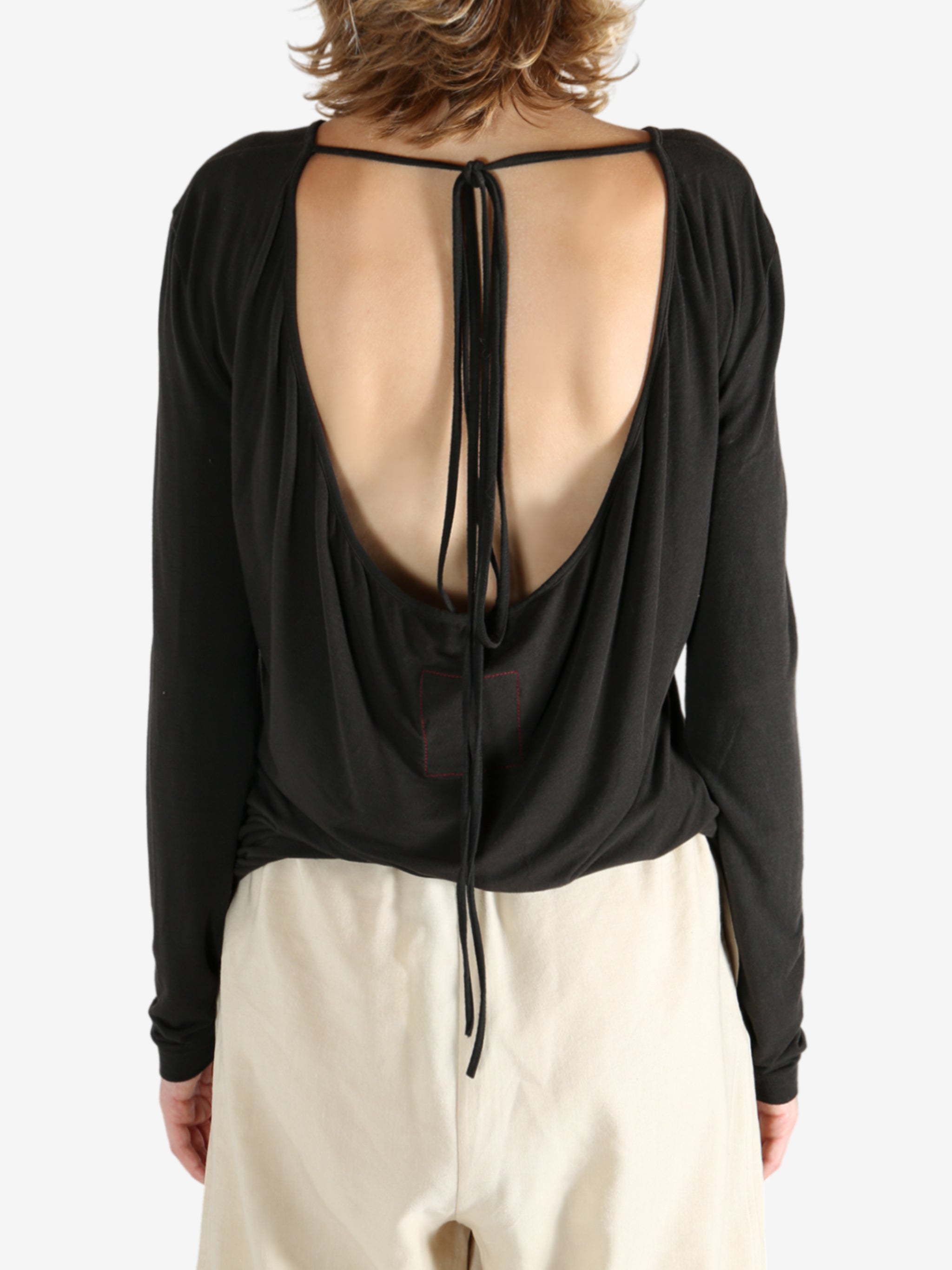 Brown top worn by a person, showing the top fit