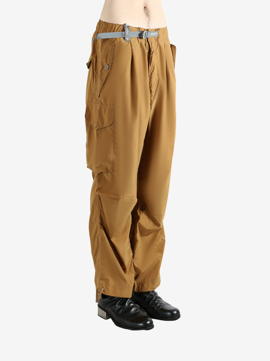Brown pants worn by a person, showing the pants's fit