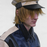 Tan hat worn by a person, showing the hat fit