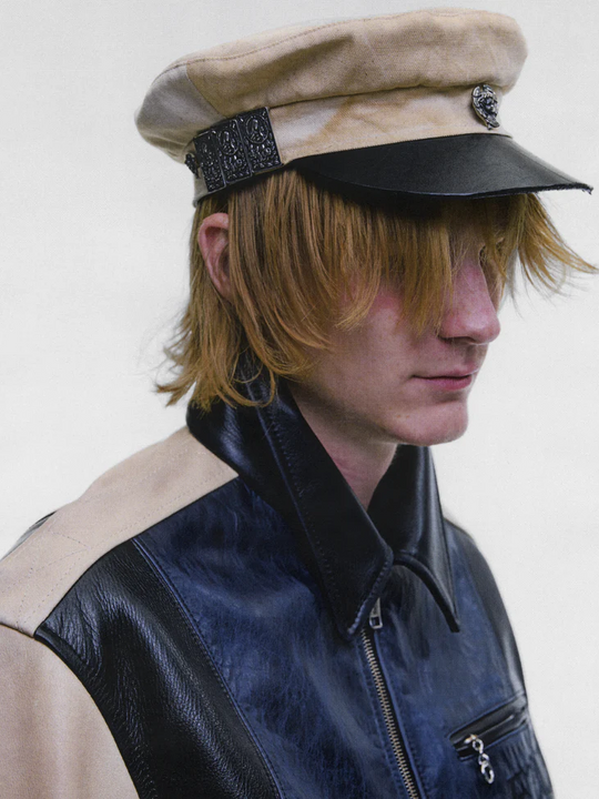 Tan hat worn by a person, showing the hat fit