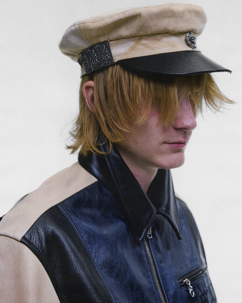 Tan hat worn by a person, showing the hat fit