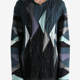 Black top worn by a person, showing the top's fit