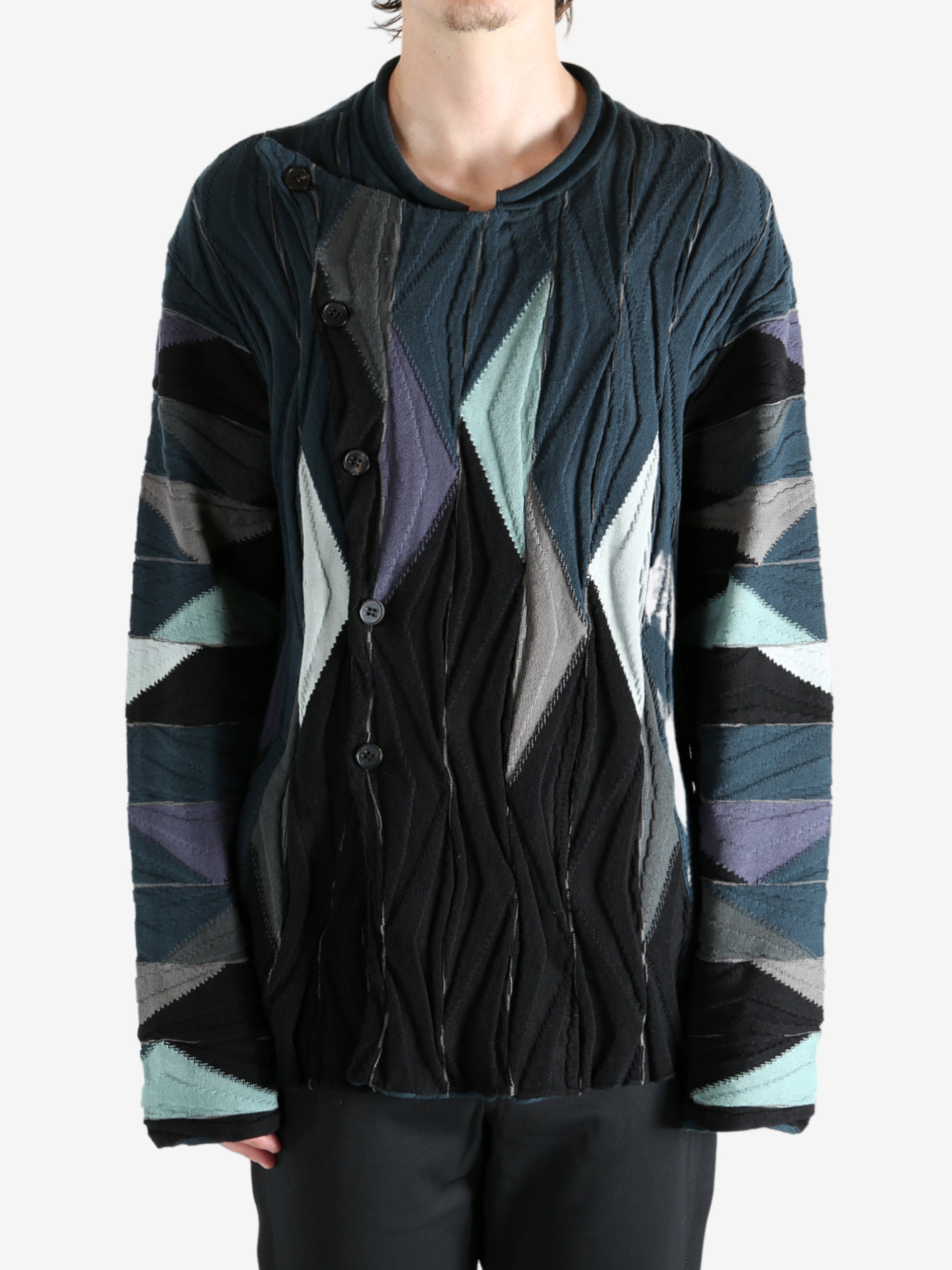 Black top worn by a person, showing the top's fit