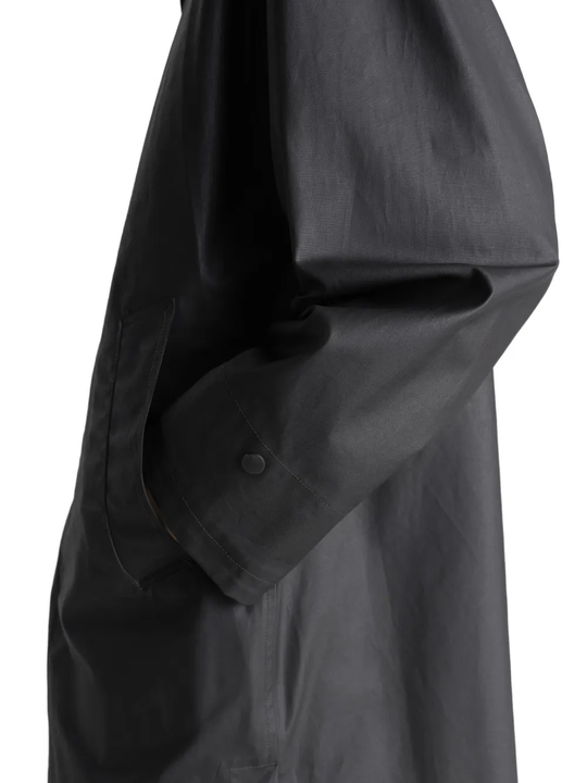 Close up of black jacket, showing the detail of the cotton material