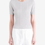 Grey shirt worn by a person, showing the shirt fit