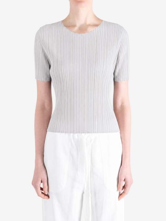 Grey shirt worn by a person, showing the shirt fit