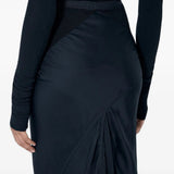 Black skirt worn by a person, showing the skirt fit