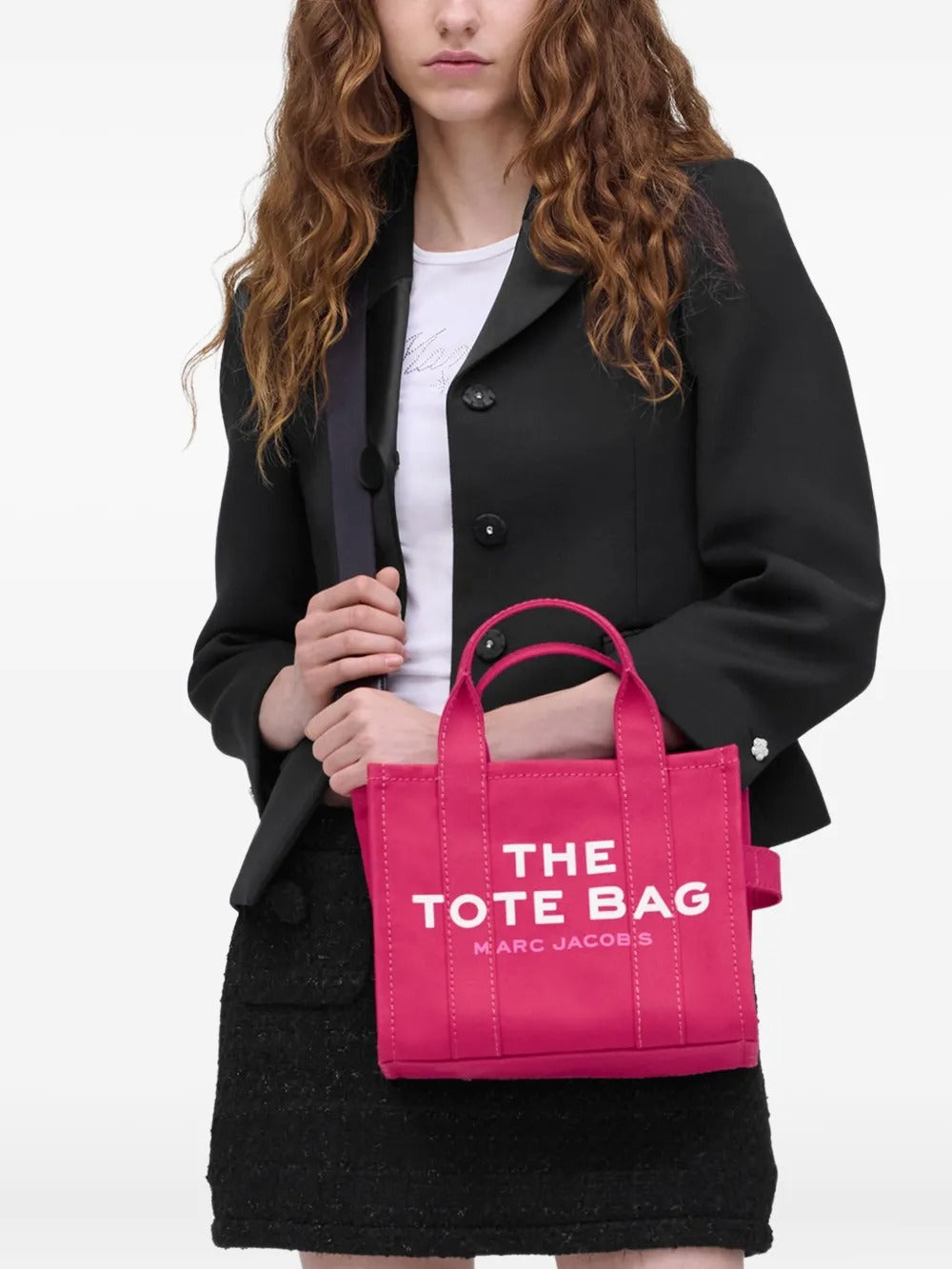 Pink bag carried by a person, showing the bag's size