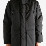 Black jacket worn by a person, showing the jacket's fit