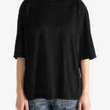 Black t-shirt worn by a person, showing the shirt's fit