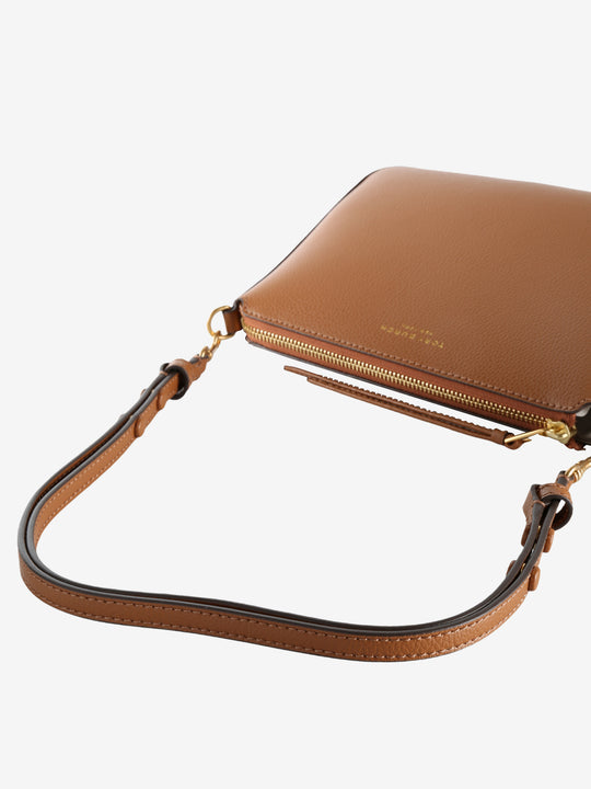 Close up of the brown bag, showing texture of the leather fabric